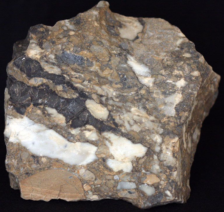 Colour image of brown rock with white spots