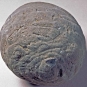 Colour photograph of gray round ball